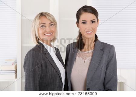Team Portrait: Successful business woman making career in management positions.