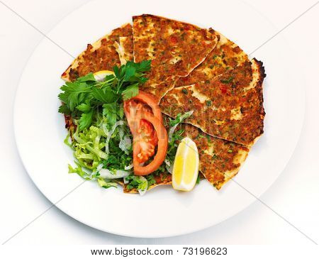 Homemade traditional Turkish meal pide stuffed with meat cheese,  and sauce isolated on white background