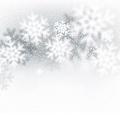 Blurred winter background with defocused snowflakes. Christmas illustration. 
