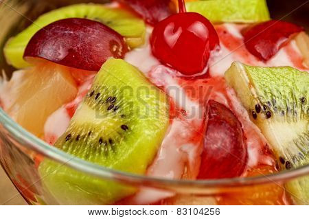 Fruit salad with ice cream in plate 