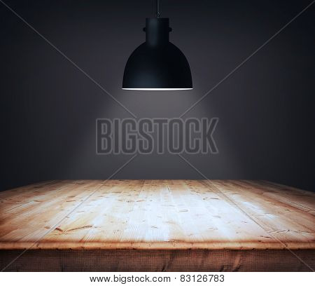 Empty wooden table and black plafond above