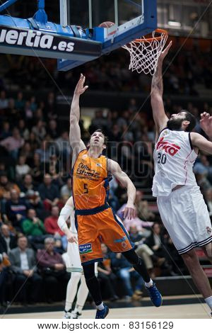VALENCIA, SPAIN - FEBRUARY 15: Ribas 5 and Bourousis 30 during Spanish League match between Valencia Basket Club and Real Madrid at Fonteta Stadium on February 15, 2015 in Valencia, Spain