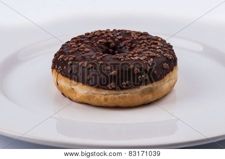 Donut With Chololate Glaze On White Plate