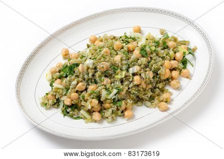 Freekeh salad with chickpeas, onion, parsley, celery, and a lemon juice and olive oil dressing