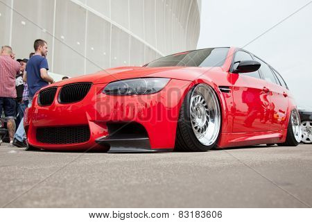 WROCLAW, POLAND: JUNE 28, 2014: Red BMW lowrider on a motor show in Wroclaw