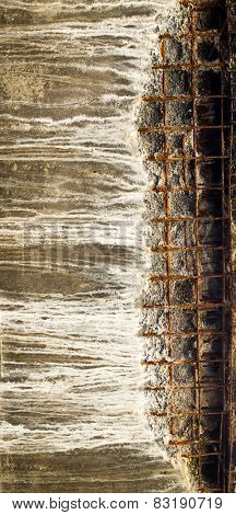 Grey Concrete Block With Visible Reinforcing Mesh