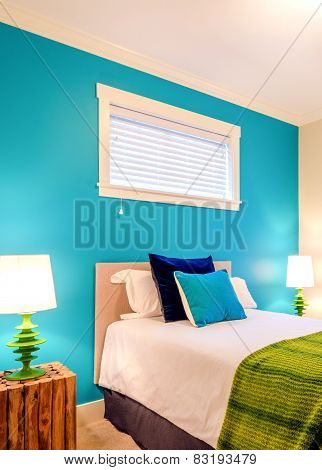 Modern blue bedroom interior in a luxury house with reclaimed wood bedside tables