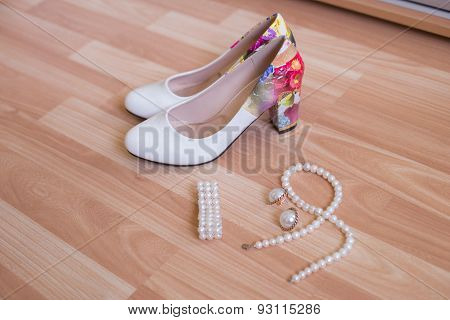 wedding shoes bracelet and earrings, a necklace