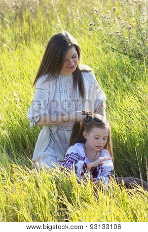 Mother Daughter Weaves A Braid