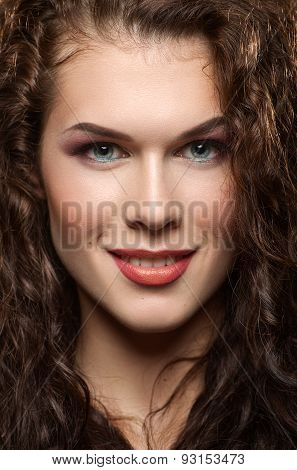 Close-up Portrait Of Beautiful Girl With Curly Hair