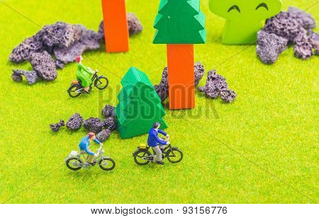 Image Group Of People(mini Figure) With Retro Bicycle In A Park - Outdoor Portrait