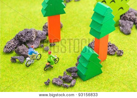 Image Of Man And Woman(mini Figure Dolls) With Retro Bicycle In A Park.