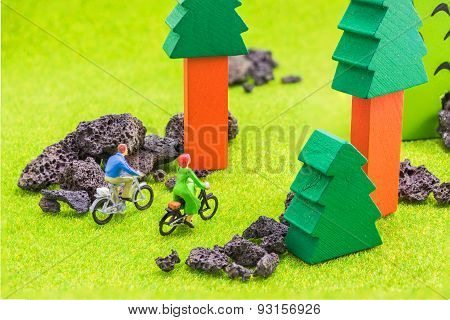 Image Of Man And Woman(mini Figure Dolls) With Retro Bicycle In A Park.