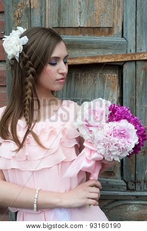 Beautiful sad woman with flower...