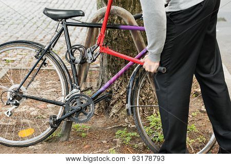 Thief Breaking The Bicycle Lock