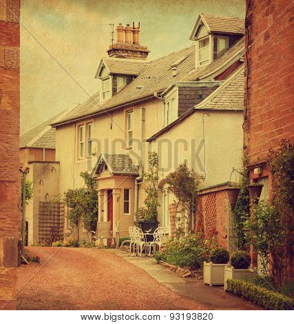 Old House in Melrose.  Melrose is a small town and civil parish in the Scottish Borders, UK. Photo in retro style. Added paper texture. Toned image