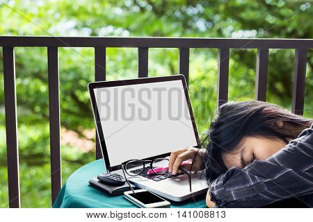 Women Tired Or Exhausted And Doze Off On Table With Laptop