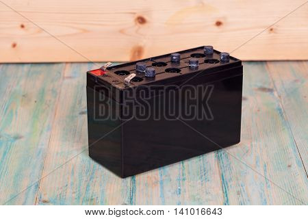 Open Sealed battery on wwood background Seletive focus
