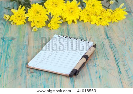 Blank mock up note book c on wood