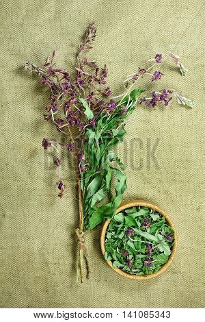 Fireweed.Dried herbs for use in alternative medicine.Herbal medicine phytotherapy medicinal herbs.For preparation of infusions decoctions tinctures powders ointments tea.Background green cloth