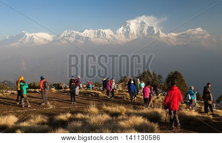 POON HILL NEPAL 8th APRIL 2016 - morning view of Poon hill with tourists and panoramic view of mount Dhaulagiri. Poon hill is one of the best view points to Dhaulagiri and Annapurna.