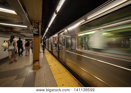 Subway train arriving at platform in Penn Station New York City New York USA