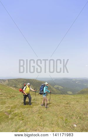 Hiking in the mountains in the summer on a sunny day.