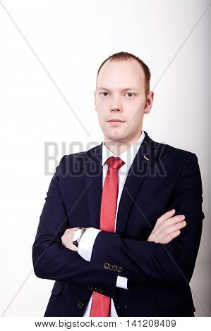 Successful businessman in formal suit chacking time on wrist watch isolated over white
