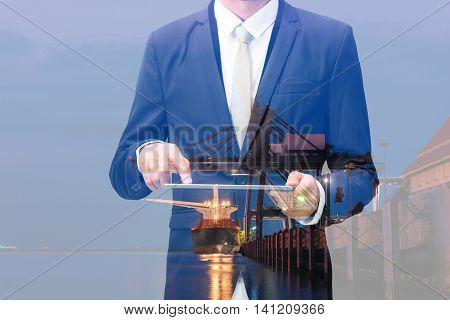 Double Exposure Of Businessman Hand Hold Tablet