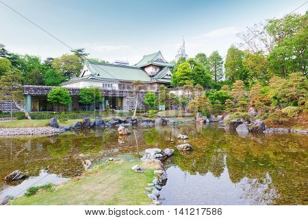 Toyama Castle With Beautiful Garden And Reflection In Water.