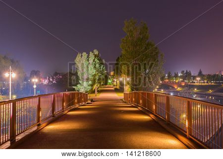 Beautiful Architecture Building And Colorful Bridge In Twilight Time.