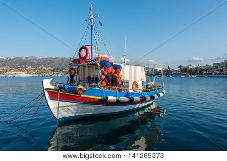 Traditional Greek wooden fishing boat at port of Sitia town in eastern part of Crete island, Greece