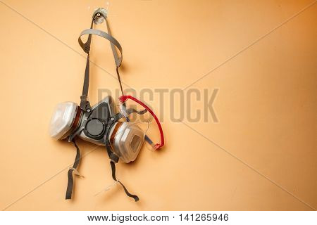 Respirator mask on the wall. Copy space