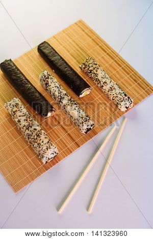 Unsliced Sushi Maki Isolated On White Background