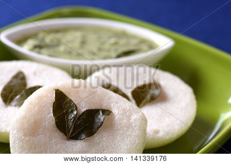 Idli With Coconut Chutney On Blue Background, Indian Dish : South Indian Favourite Food Rava Idli Or