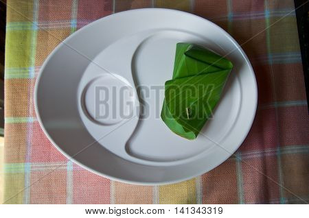 Thai style dessert Khanom Sod-Sai (Steamed Flour with Coconut Filling). - finger food