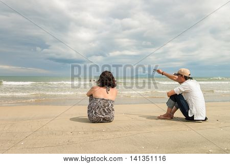 Man And Woman Looking Into Sea At China Beach Danang