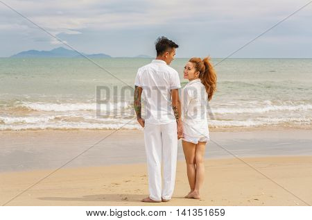 Young Couple Looking At Each Other At China Beach Danang