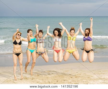 Young Girls Jumping At China Beach In Danang In Vietnam