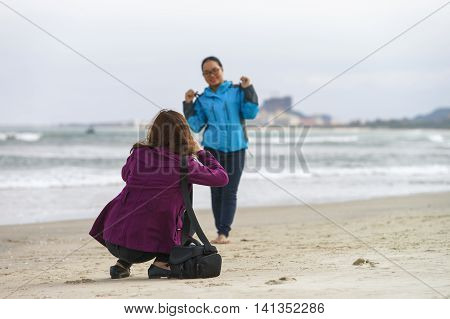 Young Girls Taking Photos In China Beach Danang