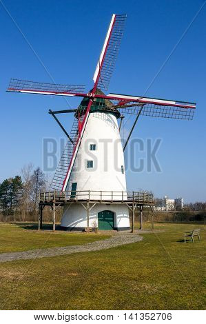 White windmill on a blue sky near Antwerp Belgium