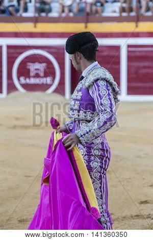 Sabiote Spain - August 23 2014: Bullfighter with the capote or cape Spain Sabiote Spain