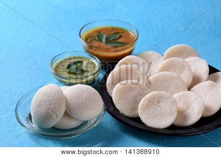 Idli With Sambar And Coconut Chutney On Blue Background, Indian Dish : South Indian Favourite Food R