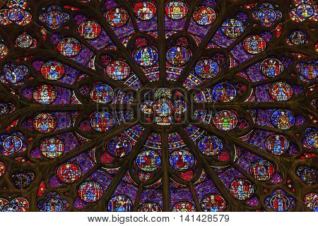 PARIS, FRANCE - MAY 31, 2015 South Rose Window VJesus Disciples Stained Glass Notre Dame Cathedral Paris France. Notre Dame was built between 1163 and 1250 AD.