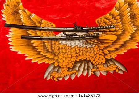 Japanese Daisho the Katana and wakisaxhi against a velvety eagle background