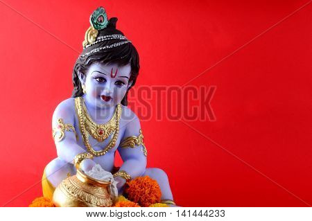 Hindu God Krishna on red background. Greeting Design