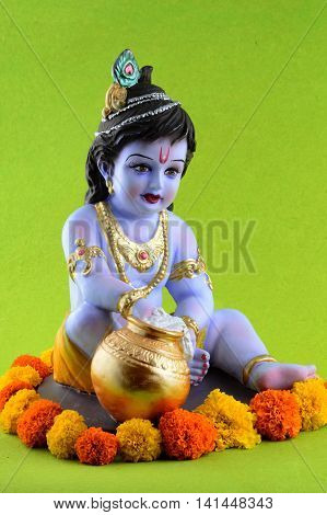 Hindu God Krishna on green background. Greeting