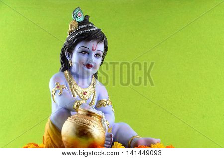 Hindu God Krishna on green background. Greeting