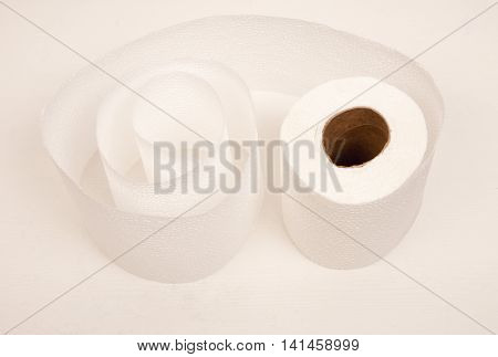 White toilet paper twisted into a spiral.