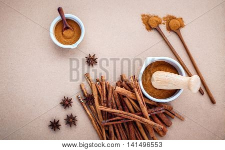 Composition Of Cinnamon Stick And Cinnamon Powder In White Mortar With Star Anise ,bay Leaves And Wo